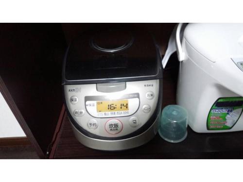 a scale sitting on a counter next to a printer at KY Apartment - Vacation STAY 40189v in Naha