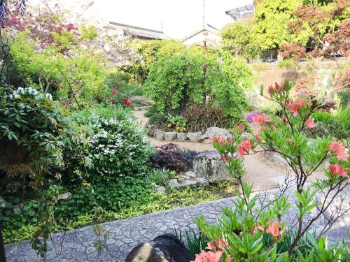 a garden with colorful flowers and plants at Himeji Castle's inner sanctum 400-year-old - Vacation STAY 16474 in Fukusaki