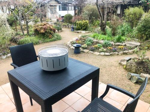 a drum sitting on a table in a garden at Himeji Castle's inner sanctum 400-year-old - Vacation STAY 16474 in Fukusaki
