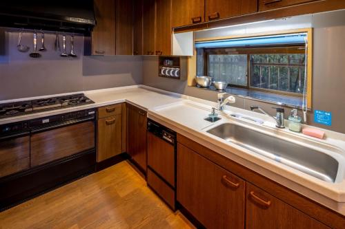 a kitchen with a sink and a stove at Chidorian - Vacation STAY 44553v in Awaji