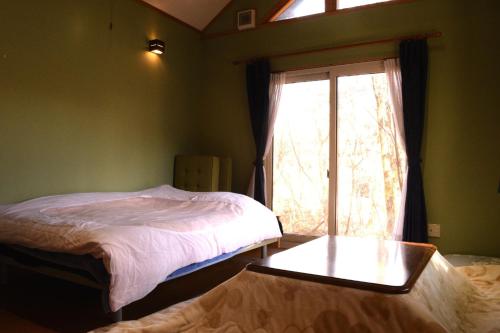 Giường trong phòng chung tại Minsyuku Sasamoriya - Vacation STAY 60420v