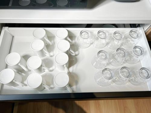 a tray filled with cups and glasses on a table at nyans - Vacation STAY 60127v in Matsue
