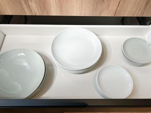 four white plates are sitting on a white tray at nyans - Vacation STAY 60127v in Matsue