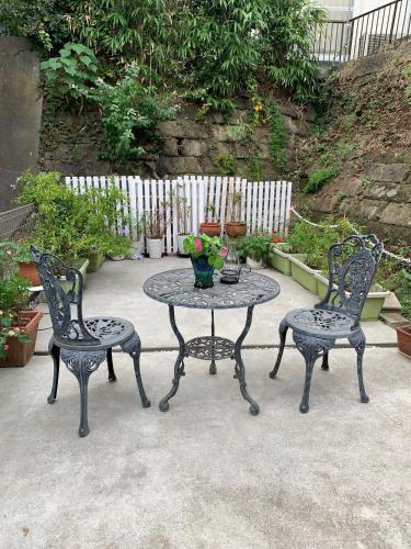 a table and two chairs and a table and chairs at Calm Enoshima 102 - Vacation STAY 61941v in Kamakura