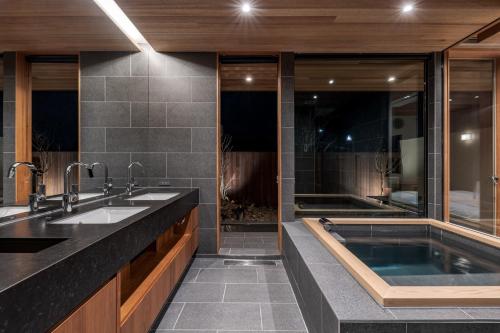a bathroom with two sinks and a bath tub at Kujukuri point 59 - Vacation STAY 49043v in Kujukuri