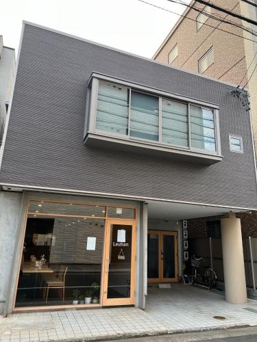 a building with a window and a table in it at Leuhan Building - Vacation STAY 57467v in Shizuoka