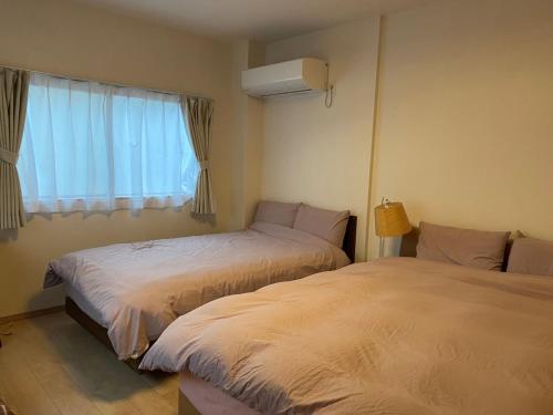 Giường trong phòng chung tại Platinum Yasaka - Vacation STAY 84649v