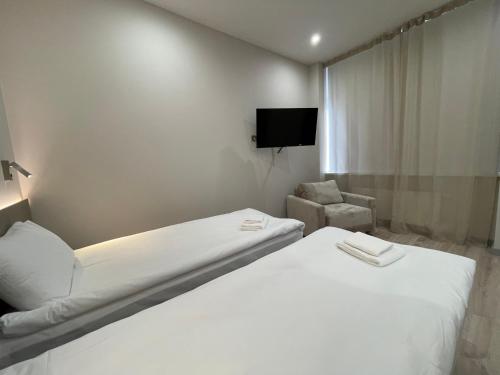 Postel nebo postele na pokoji v ubytování Aparthotel Aurum