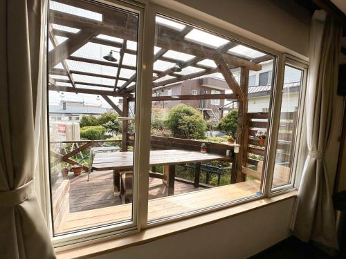 a window in a room with a table on a balcony at Nobotchi - Vacation STAY 87218v in Noboribetsu