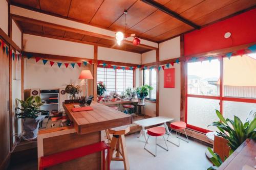 a kitchen with a table and chairs in a room at SLOW HOUSEkesennuma "Private Room 102" - Vacation STAY 89912v in Kesennuma
