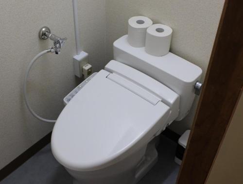 a bathroom with a toilet with two rolls of toilet paper at Mihamakan, Izu Oshima - Vacation STAY 89847v in Oshima