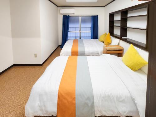 Un pat sau paturi într-o cameră la Mamada Building - Vacation STAY 18481