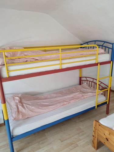 a bunk bed room with two bunk beds at Famile Hotel Kameleon in Olsberg