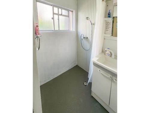 a bathroom with a shower and a sink at Mamada Building - Vacation STAY 18001 in Tokyo