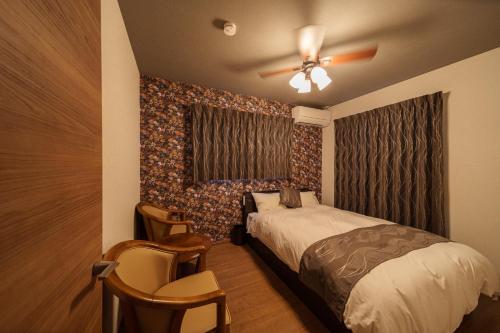 Ένα ή περισσότερα κρεβάτια σε δωμάτιο στο Utsunomiya - Vacation STAY 00433v