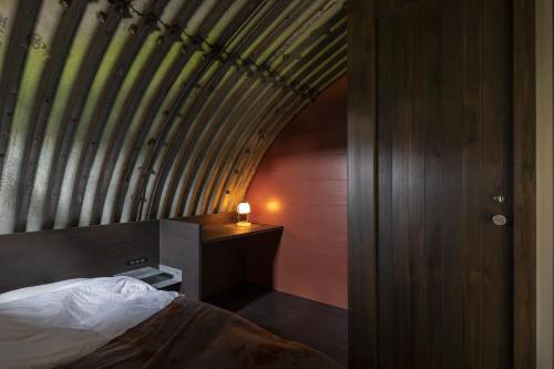 En eller flere senge i et værelse på CORRUGATED HOUSE - Vacation STAY 17005