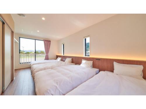 Giường trong phòng chung tại Greenpark Santo - Vacation STAY 06784v