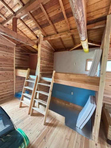a room with two bunk beds in a sauna at Bamboo Camp Site "Isumi Genji Firefly Village" - Vacation STAY 08175v in Ōtaki