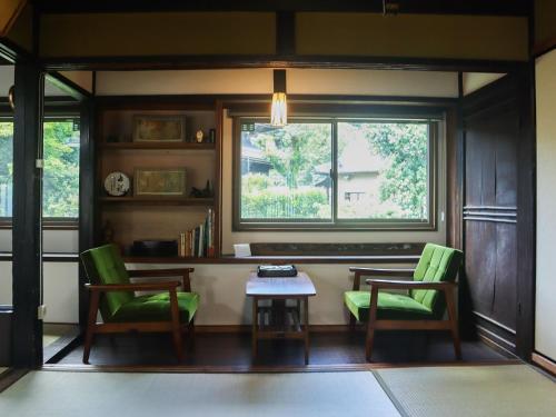 a room with two chairs and a table and a window at Mizuma no Yado - Vacation STAY 16613v in Kaizuka