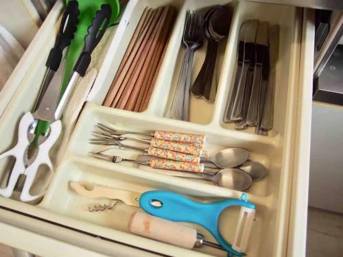 a drawer filled with lots of utensils at Piso Essauna - Vacation STAY 16990 in Igei