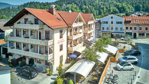 an overhead view of a town with cars parked in a parking lot at Hotel Drei Mohren in Garmisch-Partenkirchen