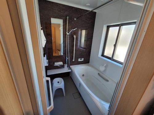 a bathroom with a tub and a sink and a toilet at Megumistay - Vacation STAY 15662v in Minamiboso