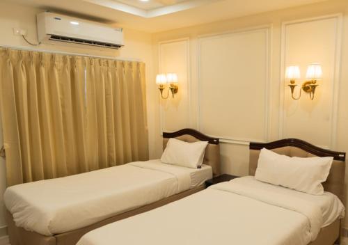 Postel nebo postele na pokoji v ubytování Hotel Granton