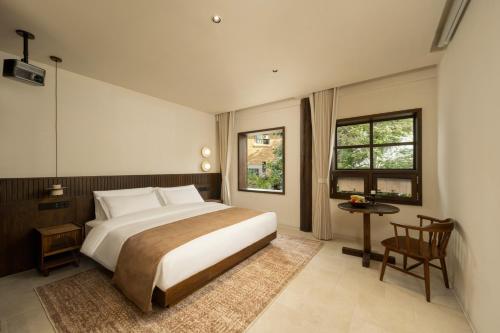 Postel nebo postele na pokoji v ubytování Zhi'an Hotel-大理枝安酒店