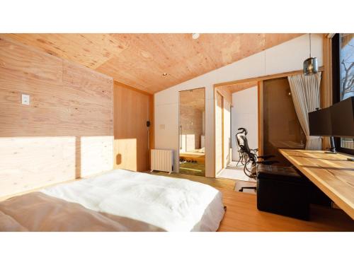a bedroom with a large white bed in a room at Mori de Waoke Nasuppo - Vacation STAY 23947v in Nasu-yumoto