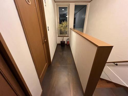 a hallway of an office building with a long corridor at casa hotel - Vacation STAY 17134 in Wakkanai
