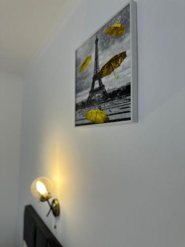 a picture of the eiffel tower on a wall at Турист in Astana