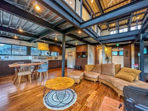 a living room with a couch and a table at EIGHT LIFE GO - Vacation STAY 17131 in Zushi