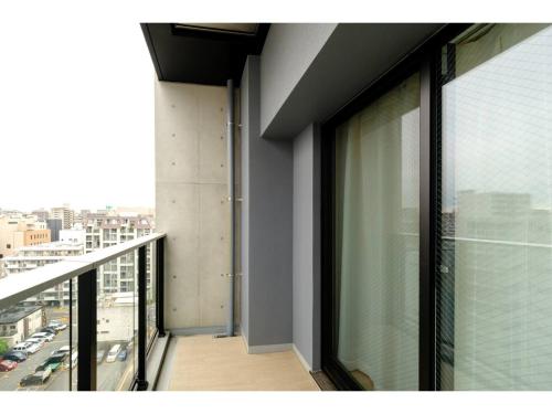 a balcony with a view of a city at ZOOM Esaka Park - Vacation STAY 17110 in Suita