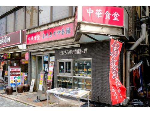 a store with signs on the side of a building at ZOOM Esaka Park - Vacation STAY 17111 in Suita