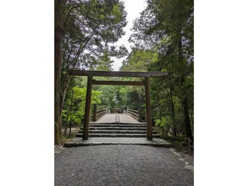 a gate on a bridge in a forest at Shinra - Vacation STAY 29374v in Ise