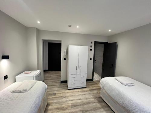 Ένα ή περισσότερα κρεβάτια σε δωμάτιο στο Comfy 5-Bedroom House in Reading
