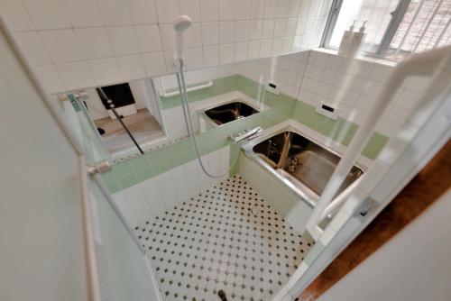 a small bathroom with a sink and a shower at Waka no Yado -Oto- - Vacation STAY 17181 in Wakayama