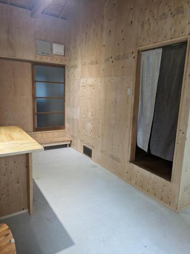 an empty room with a table and a window at HANARE STAY&SPACE - Vacation STAY 38426v in Misaki