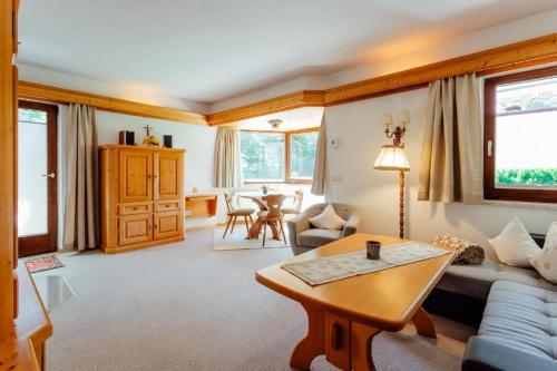 a living room with a couch and a table at Haus ANNELIES Top 3 by Moni-care in Seefeld in Tirol