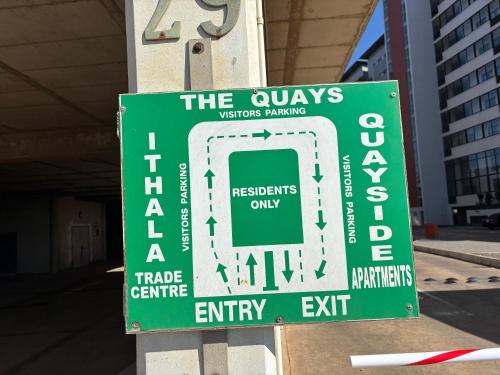 a green sign that says the owls victims parking facility at Durban Point Waterfront, 505 Quayside 40 Canalquay Rd in Durban