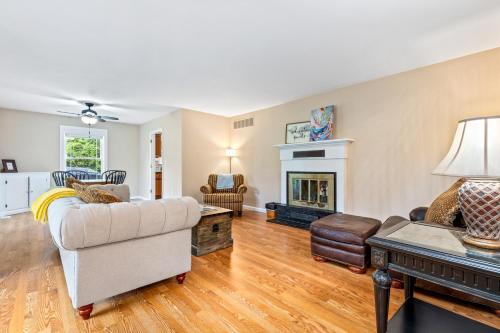 a living room with a couch and a fireplace at New!! Pool Vibes At Vanishing Run in Harwood