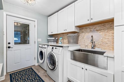a kitchen with a sink and a washing machine at New!! Pool Vibes At Vanishing Run in Harwood