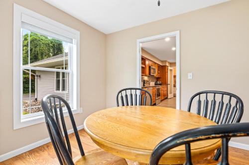 a dining room with a table and chairs and a window at New!! Pool Vibes At Vanishing Run in Harwood