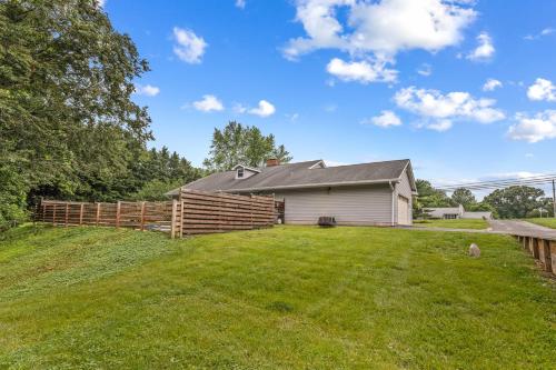 a house with a fence and a yard at New!! Pool Vibes At Vanishing Run in Harwood