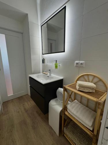 a bathroom with a sink and a mirror at Apartmán U Bedříška in Litomyšl