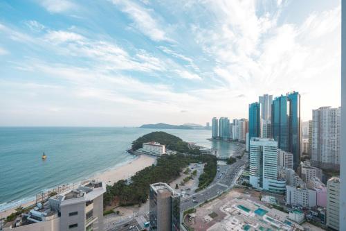 a view of the ocean and a beach with buildings at 해운대 웨이브 Haeundae wave in Busan