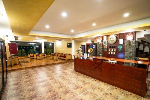 a large room with a lobby with a waiting area at Hotel C7 Munnar in Munnar
