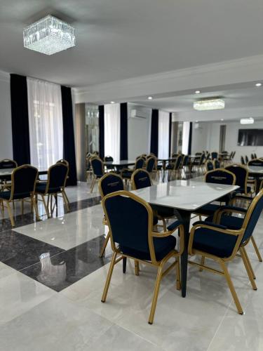 a conference room with a table and chairs at Турист in Astana