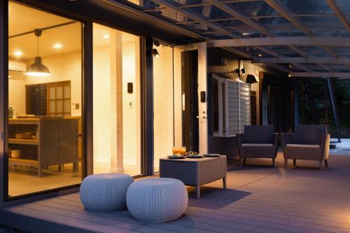 a patio with a table and chairs on a deck at mion - Vacation STAY 52998v in Hota