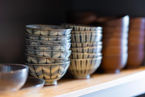 a group of bowls sitting on a shelf at mion - Vacation STAY 52998v in Hota